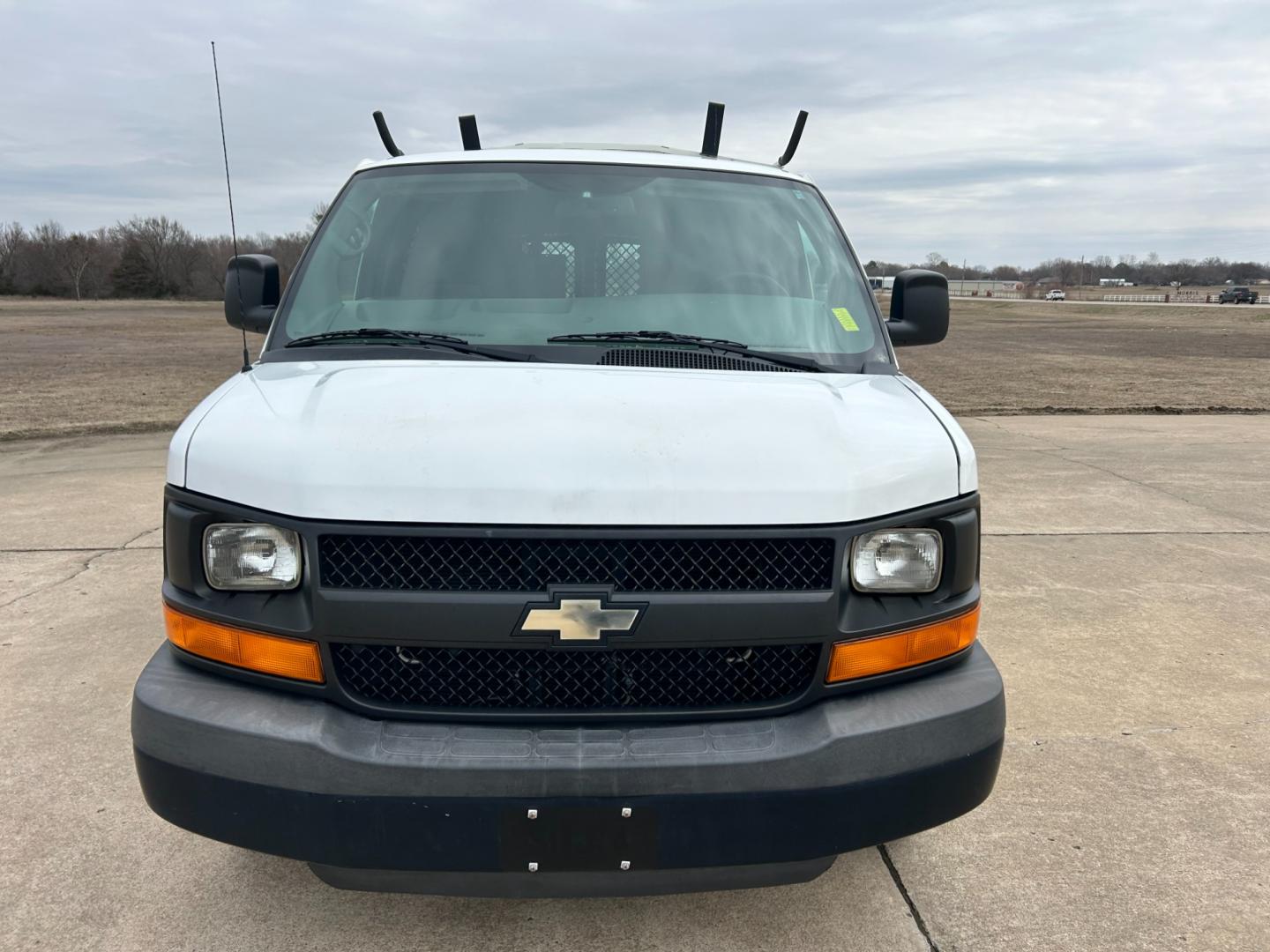 2012 White /Gray Chevrolet Express 2500 Cargo (1GCWGFCB4C1) with an 6.0L V8 OHV 16V FFV engine, 6-Speed Automatic transmission, located at 17760 Hwy 62, Morris, OK, 74445, (918) 733-4887, 35.609104, -95.877060 - 2012 CHEVROLET EXPRESS CARGO VAN 6.0L V8 RWD FEATURING MANUAL LOCKS, MANUAL WINDOWS, MANUAL MIRRORS, MANUAL SEATS, AM/FM STEREO, LEATHER SEATS, LEATHER-WRAPPED STEERING WHEEL, TRACTION CONTROL, LOCKING METAL CONSOLE, STEEL SHELVES, SPLIT SWING-OUT RIGHT DOORS, RUBBER MATS, LOAD-BEARING EXTERIOR RACK - Photo#1